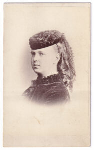 Carte de visite, with a photograph of a woman, from the late 19th century